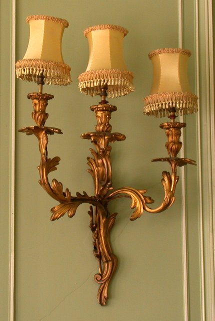 A pair of Louis XV three branch ormolu wall lights