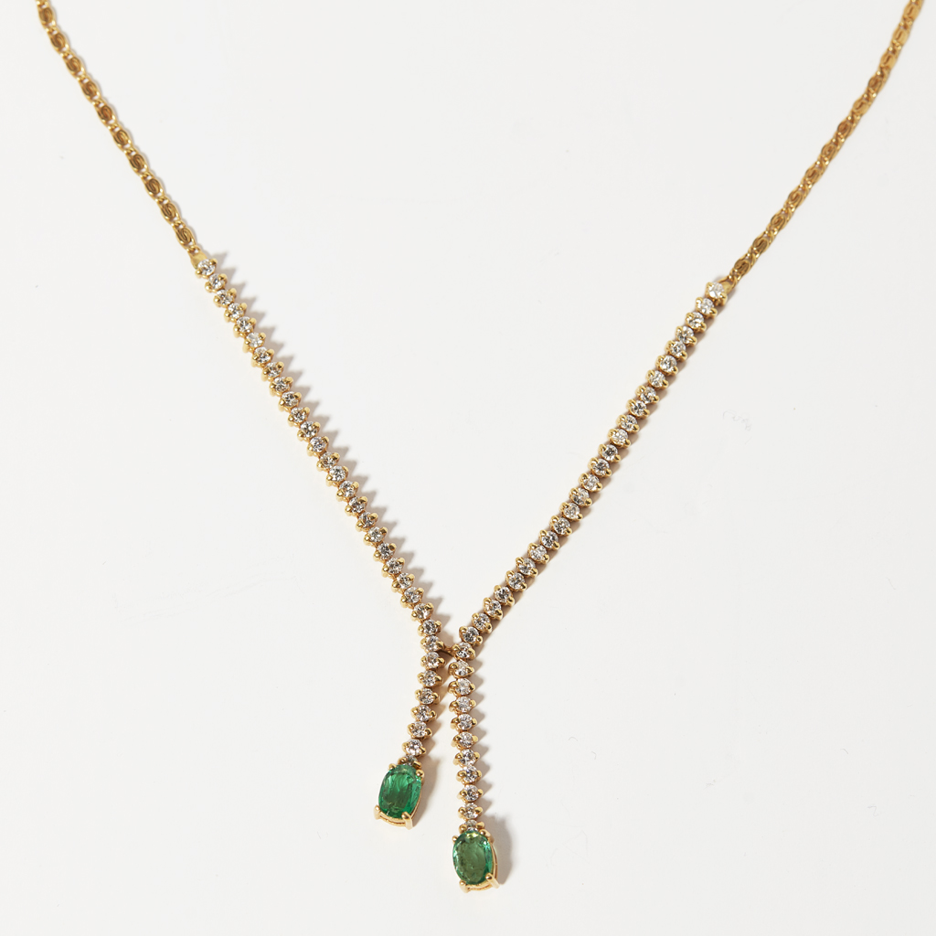 An emerald and diamond set necklace