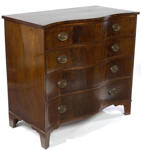 A 19th century mahogany serpentine chest