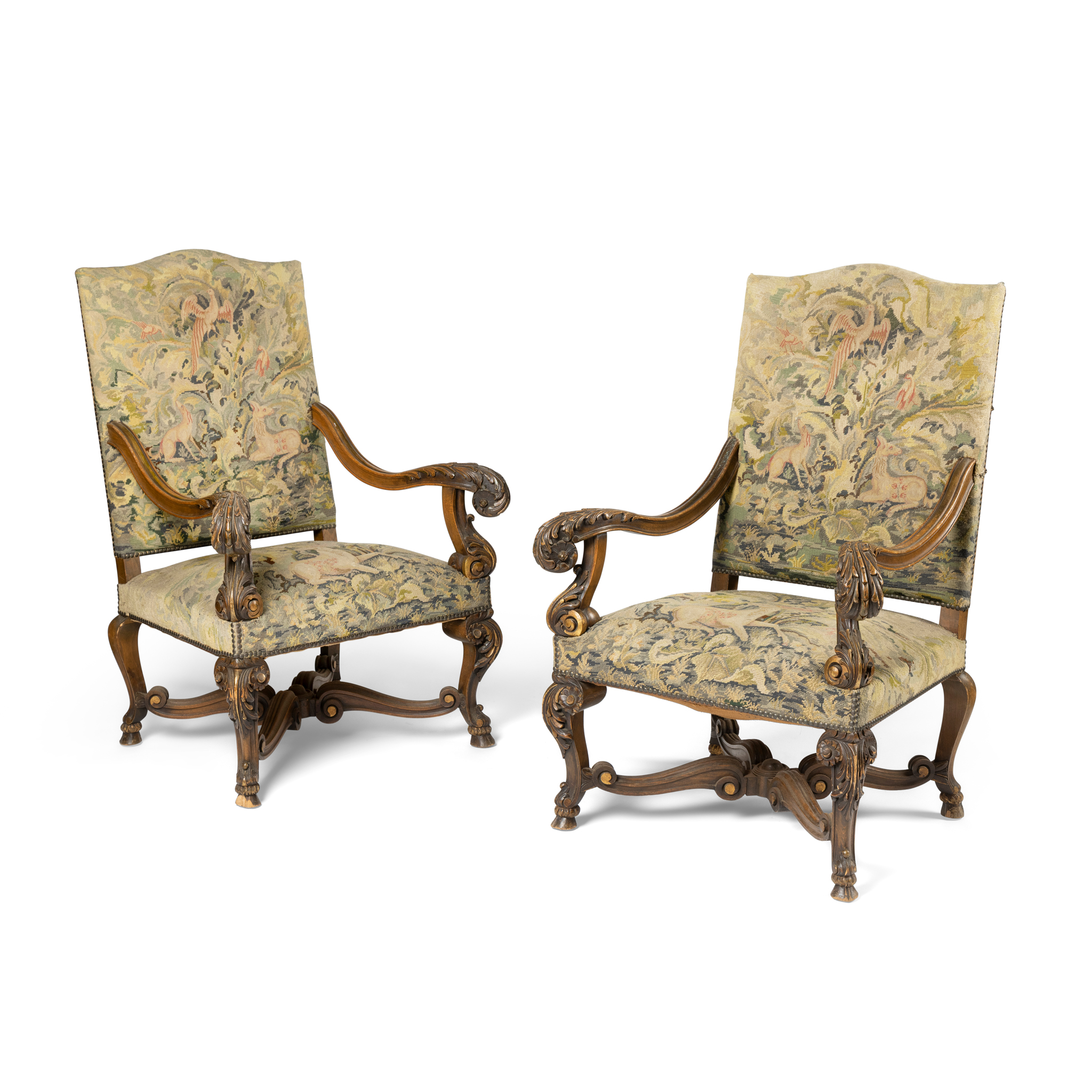 A PAIR OF CONTINENTAL BEECHWOOD AND GILT HIGHLIGHTED ARMCHAIRS
