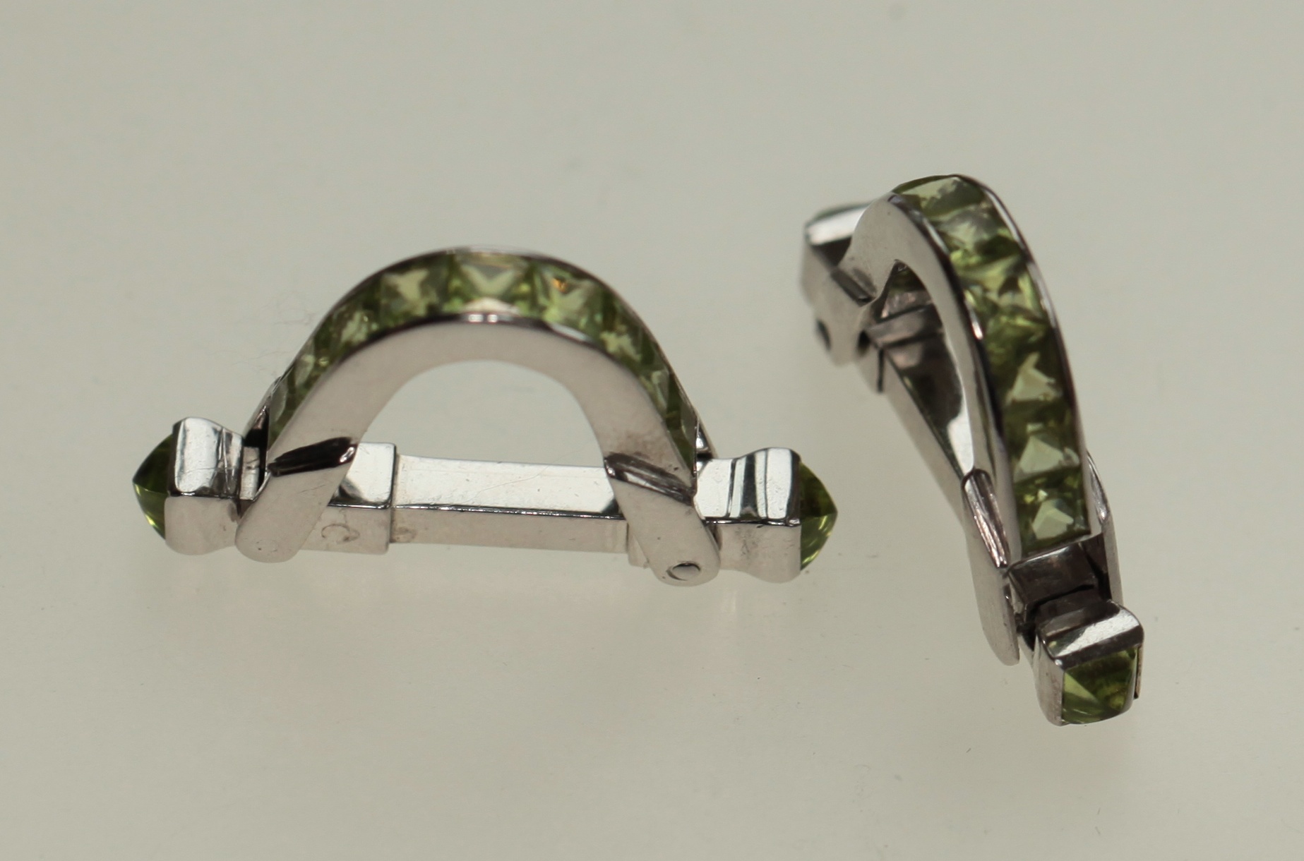 A pair of peridot set cufflinks