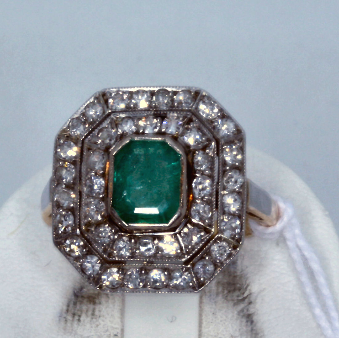 A French Art Deco emerald and diamond cluster ring,