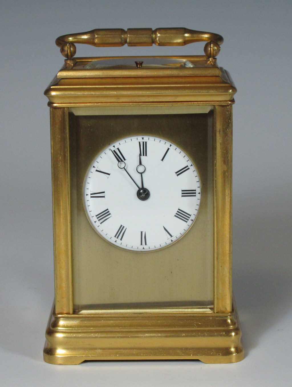 A gilt metal repeater carriage clock
