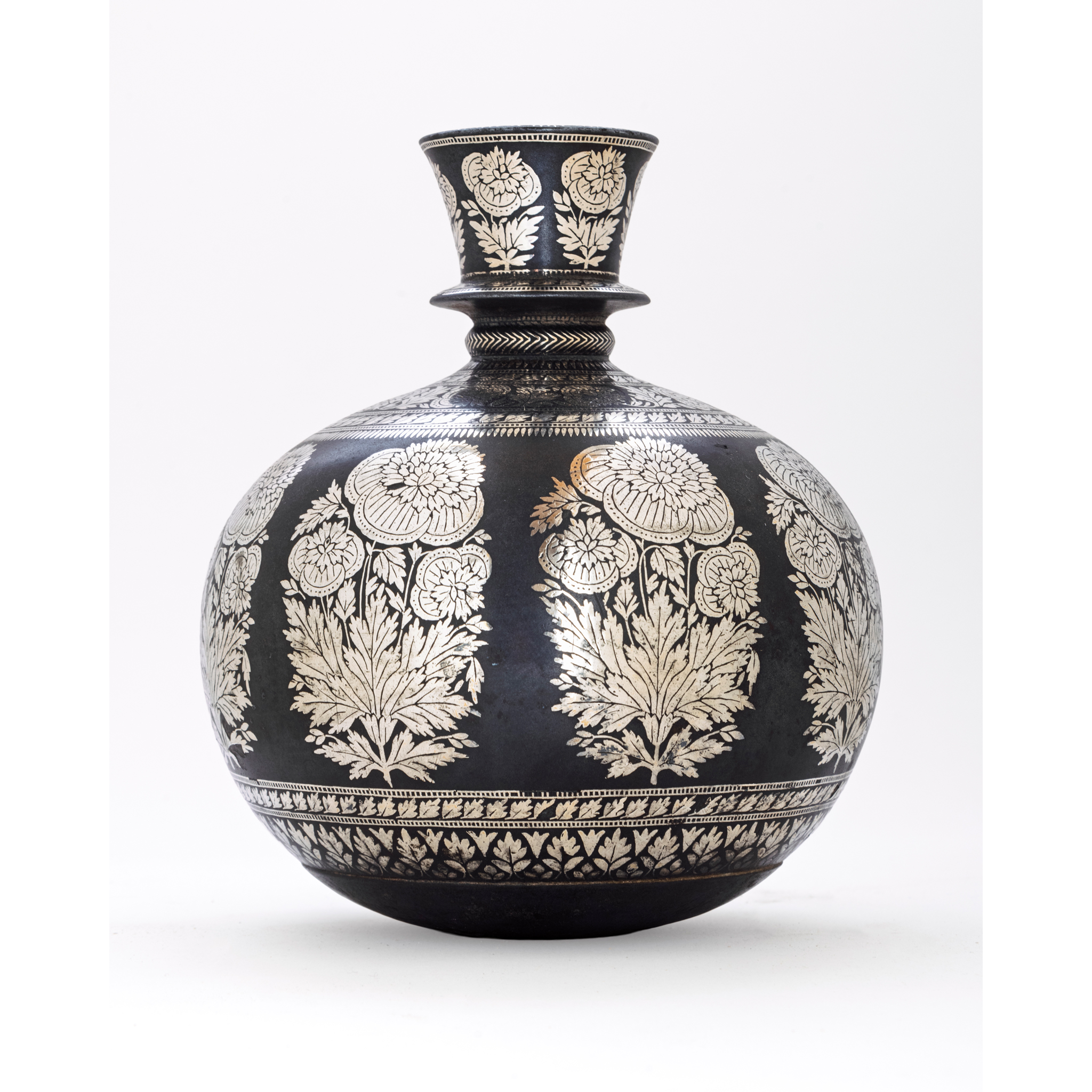 A SILVER-INLAID COPPER ALLOY BIDRI HOOKAH BASE DECORATED WITH POPPY SPRAYS