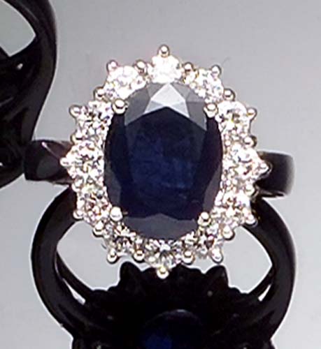 A sapphire and diamond oval cluster ring,