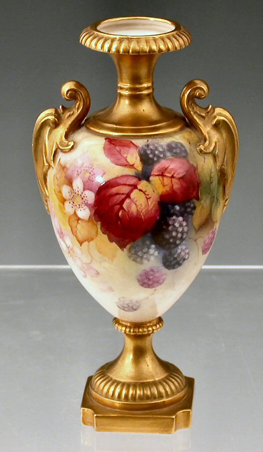 A small Royal Worcester twin handled urn