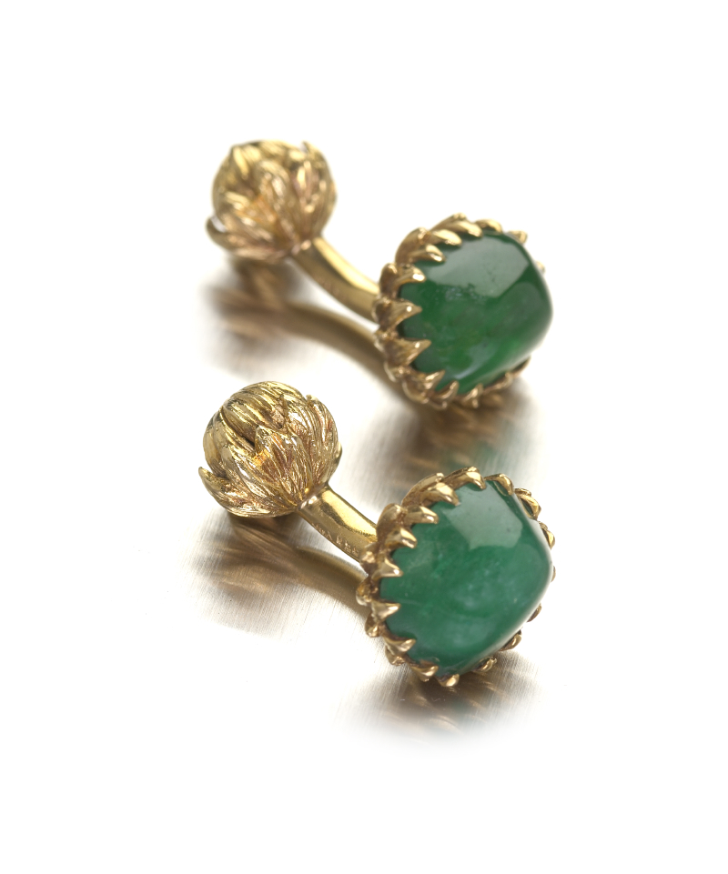 A pair of emerald cabochon set cufflinks
