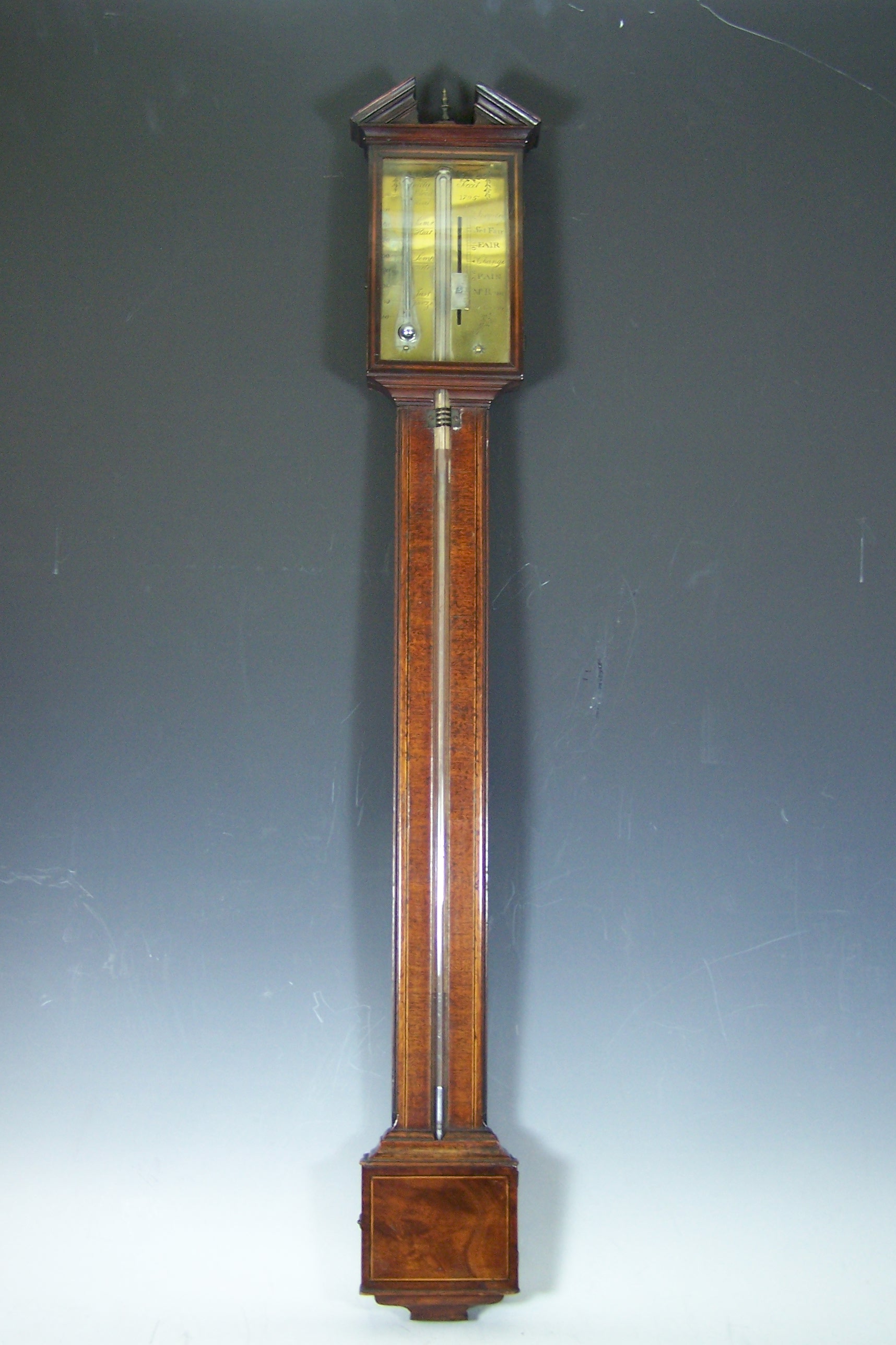 P Gally A George III mahogany cased stick barometer,