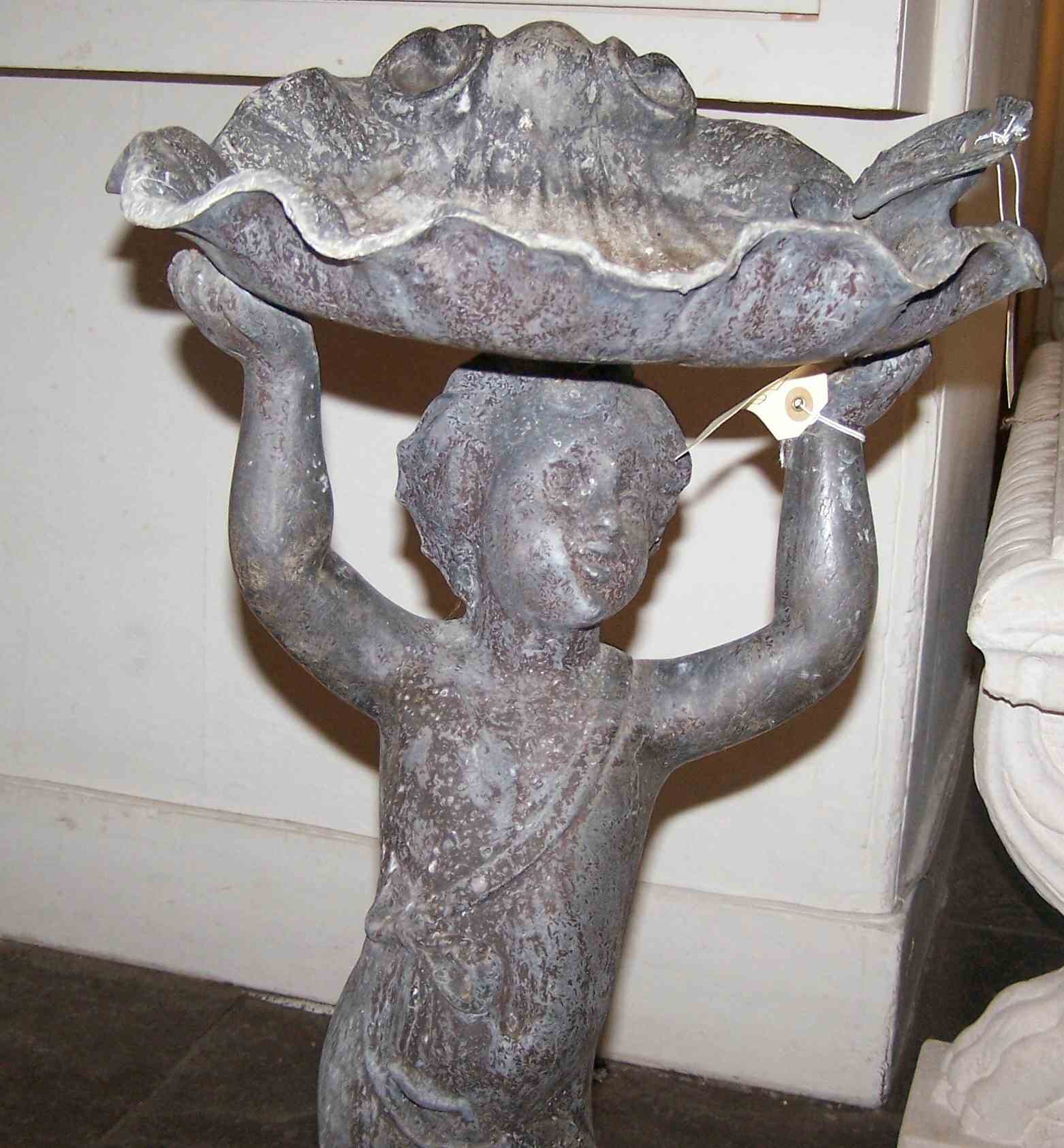 A 19th century lead figural bird bath