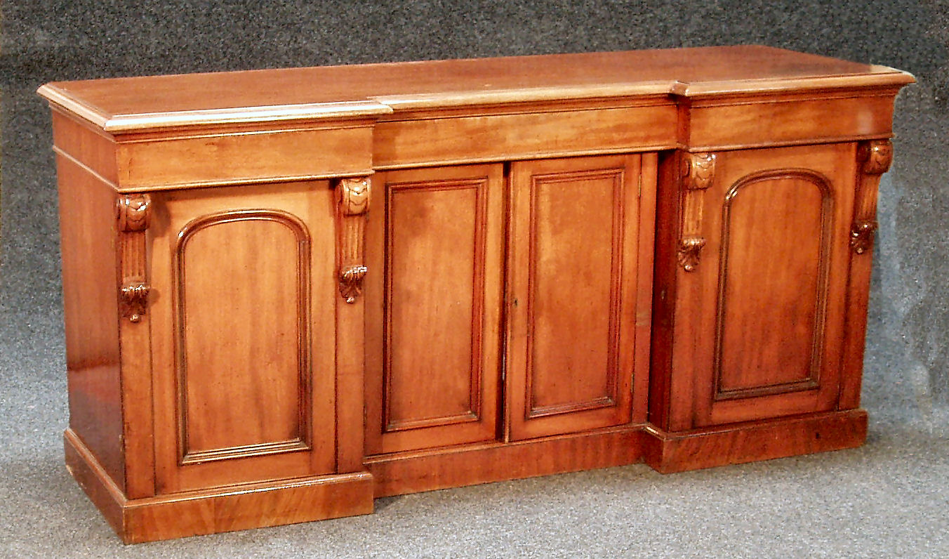 A Victorian mahogany inverted breakfront sideboard