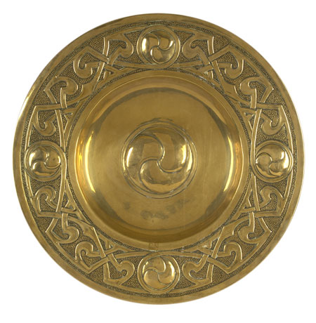 A Scottish Arts and Crafts circular brass charger Attributed to Margaret Gilmour