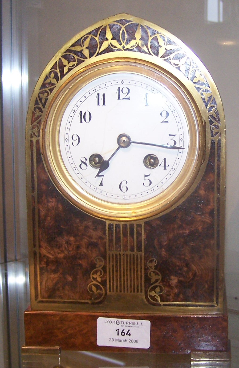 A burr walnut and brass inlaid Edwardian mantel clock,
