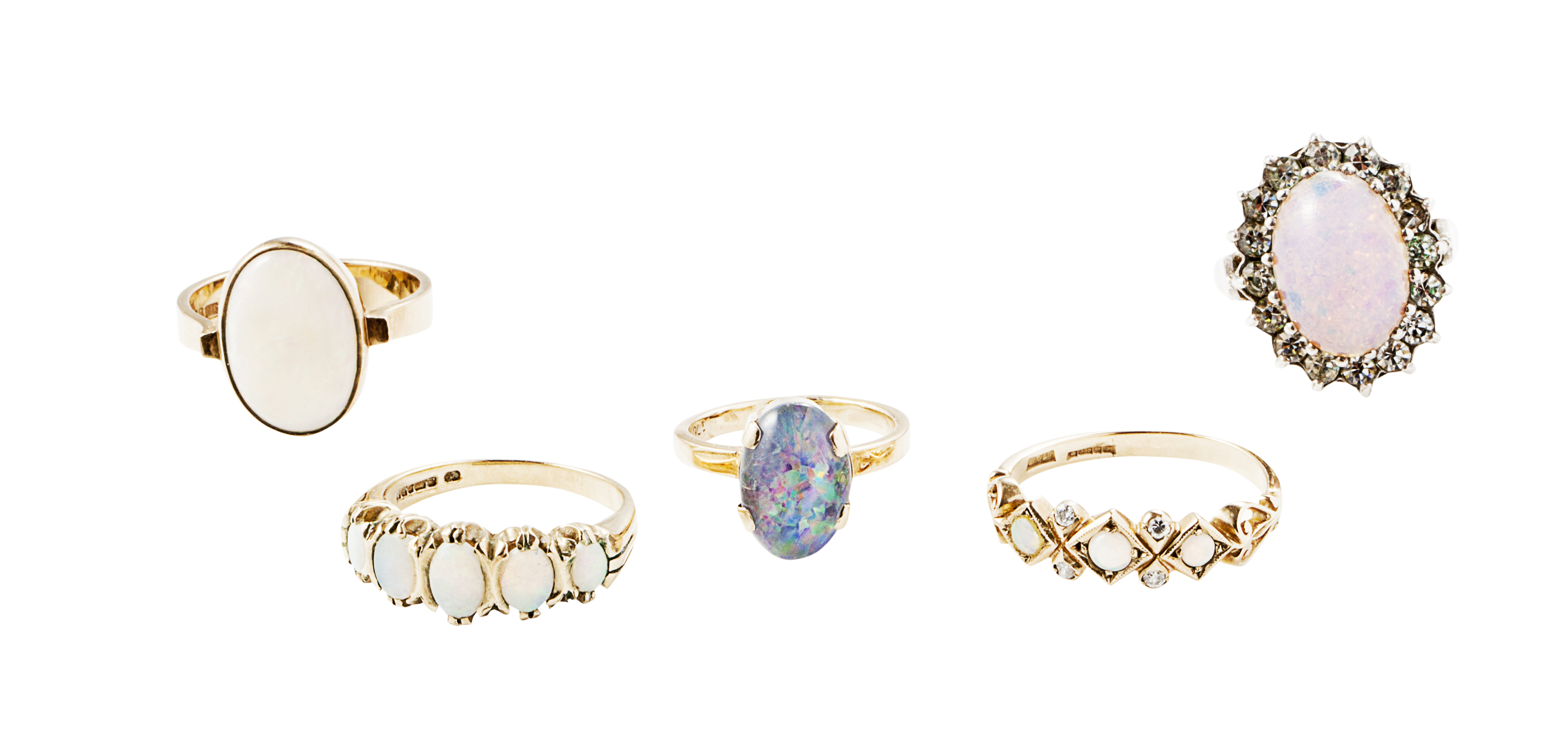 A collection of opal set rings