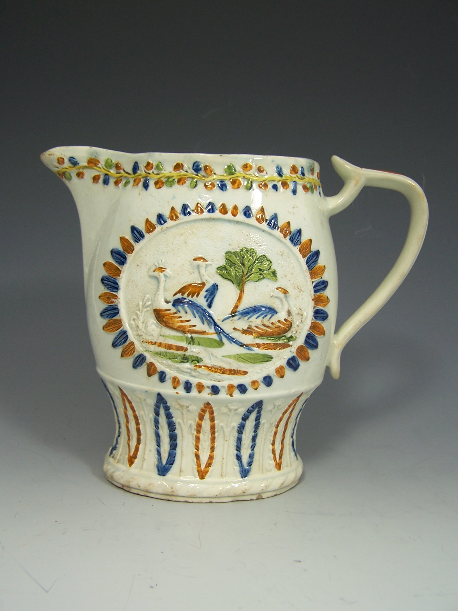 An early 19th century prattware jug