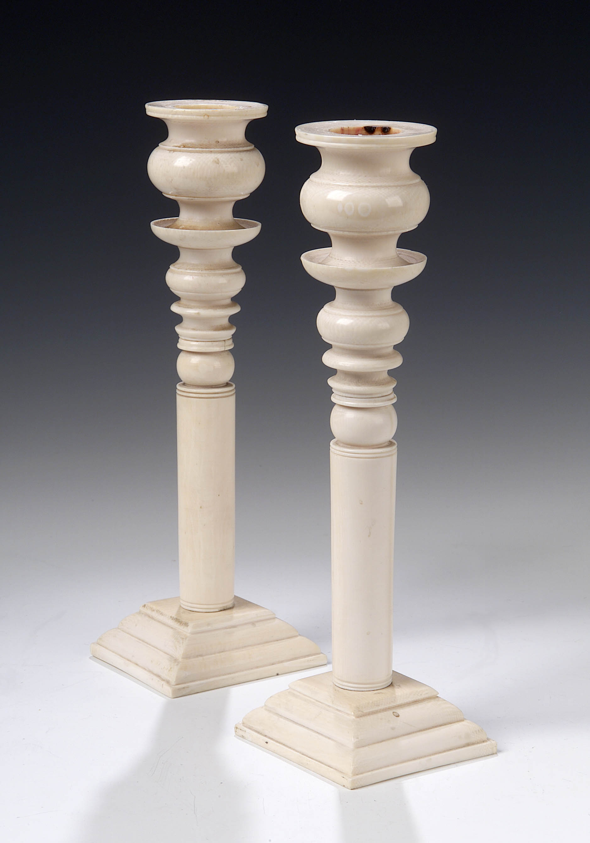 A pair of ivory candlesticks