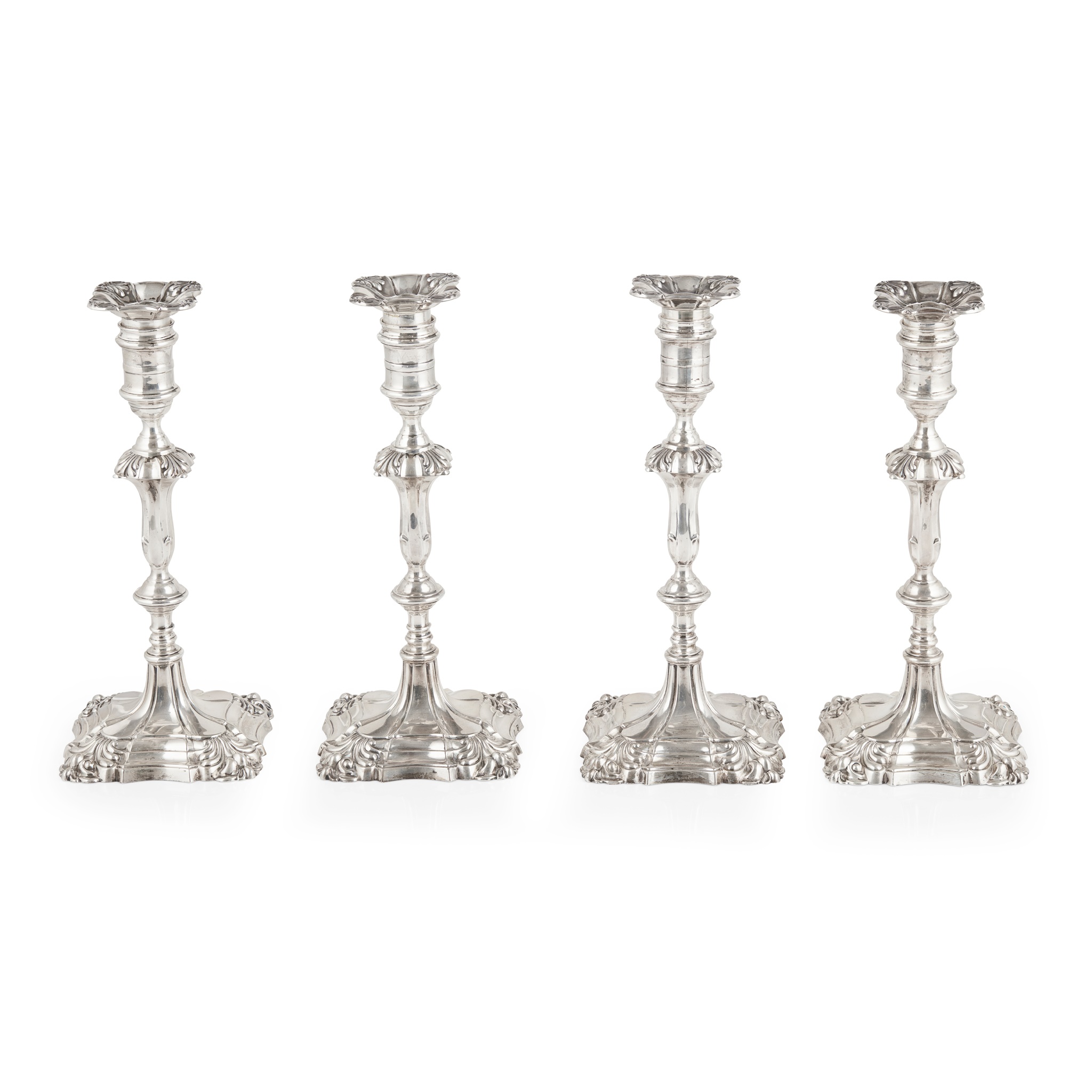 A set of four Edwardian table candlesticks