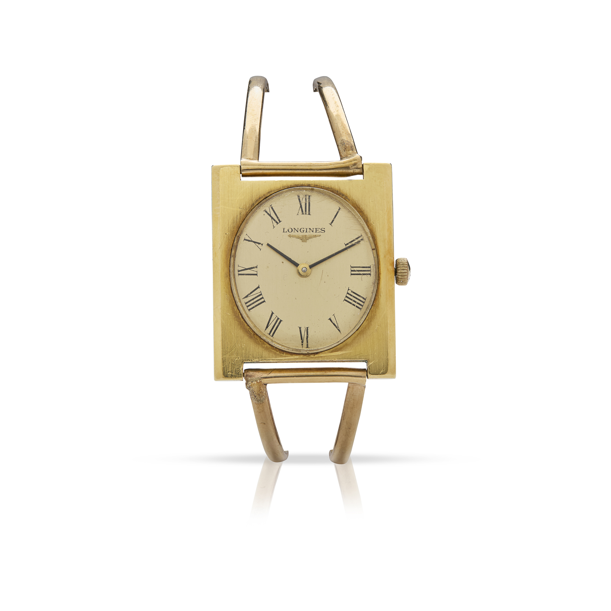Longines. An 18k gold mechanical rectangular wristwatch on 9k gold bracelet