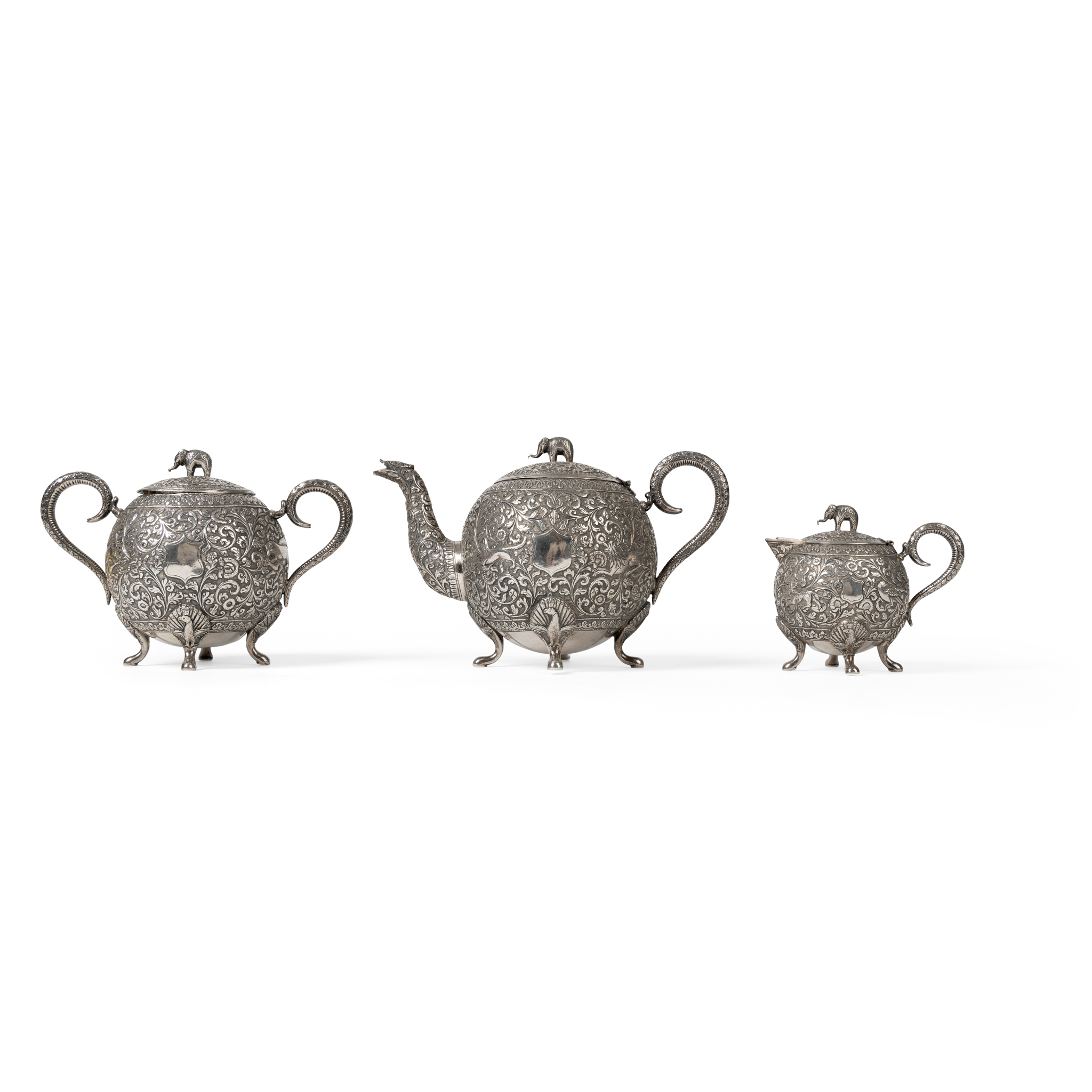A SILVER REPOUSSÉ THREE-PIECE TEASET WITH MAKERS MARK ‘VK’