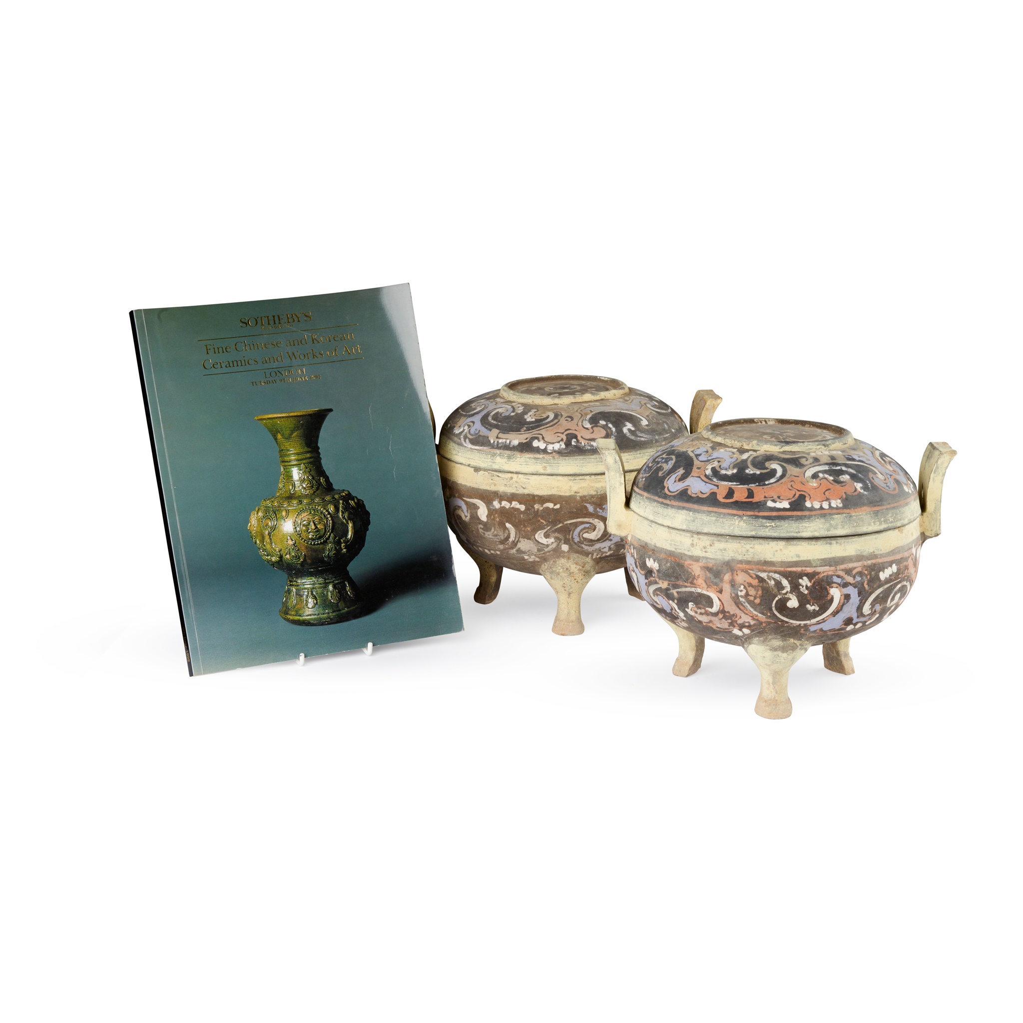 PAIR OF PAINTED GREY POTTERY TRIPOD VESSELS AND COVERS, DING