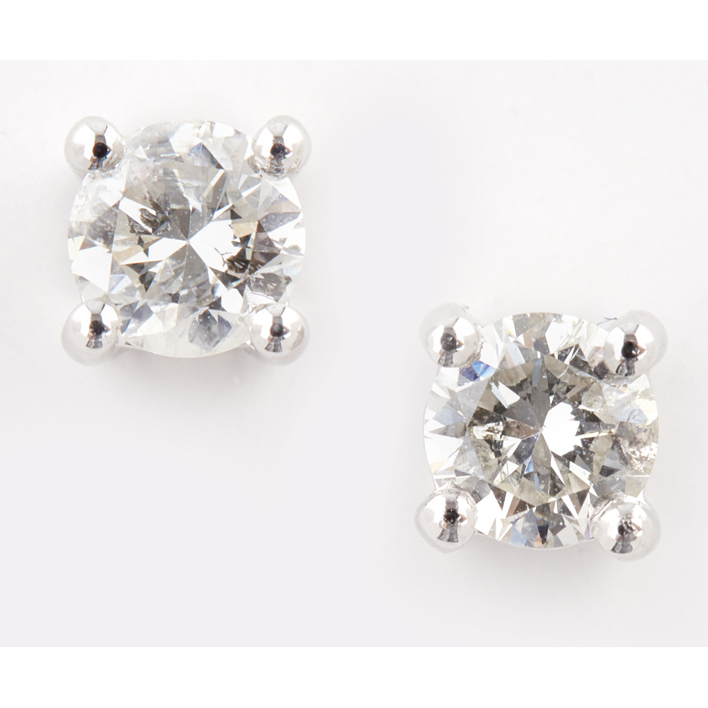 A pair of diamond set stud earrings