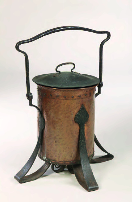 An Arts and Crafts copper and wrought iron coal bucket and cover,