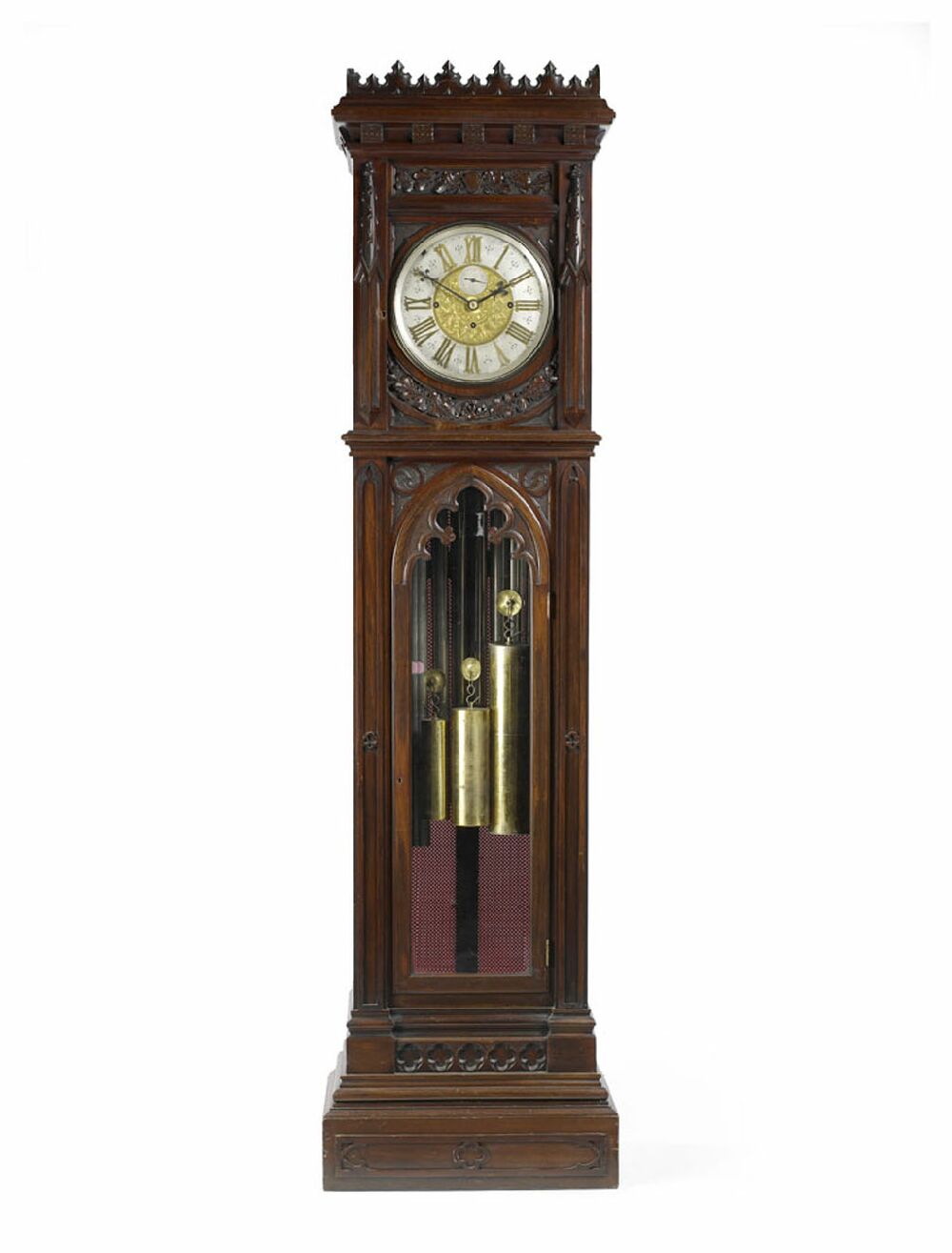 A late 19th century walnut musical longcase clock In the Gothic taste