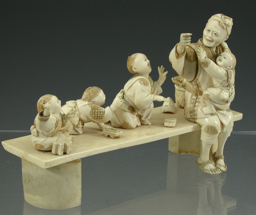 A 19th century Japanese ivory figure group