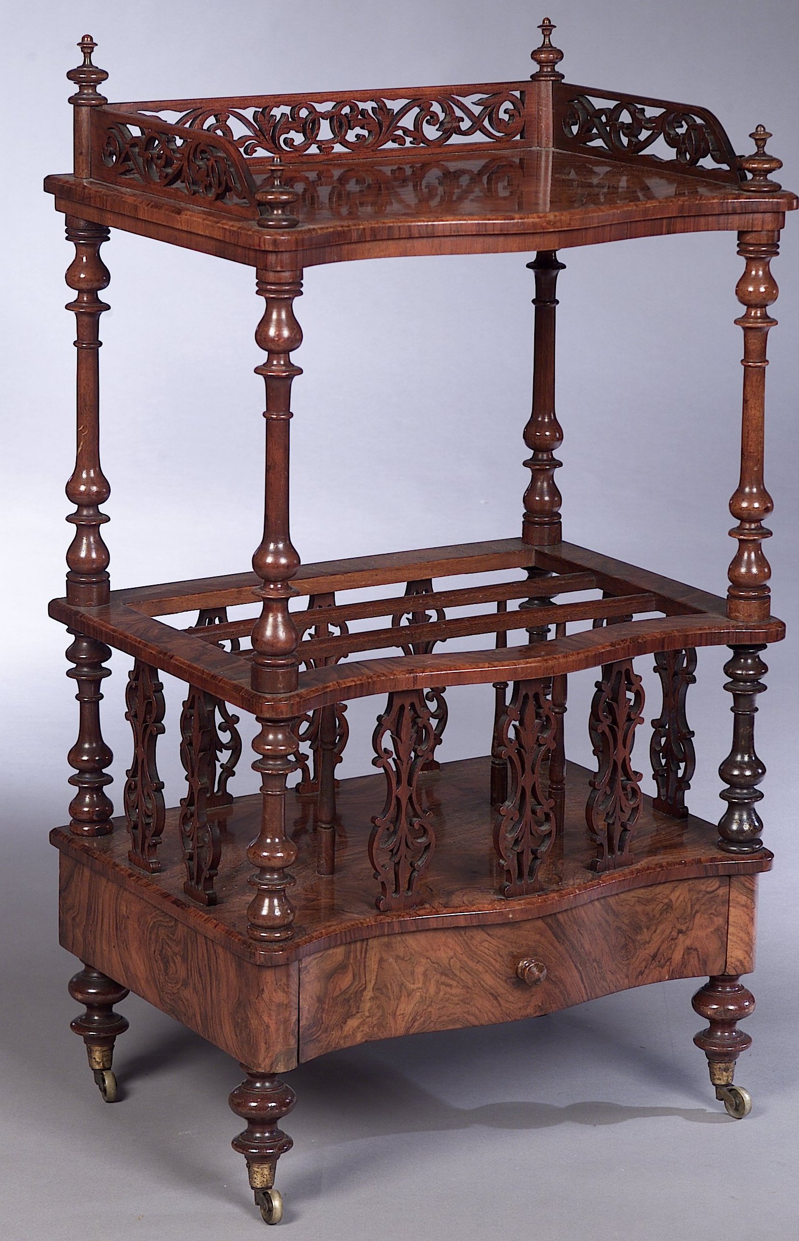 A Victorian walnut two tier Canterbury