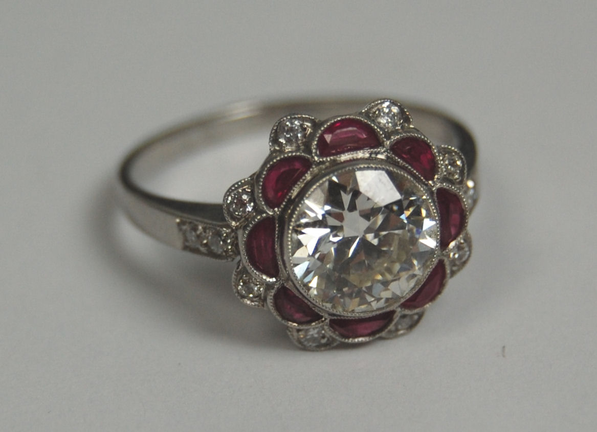 An early 20th century ruby and diamond floral cluster ring