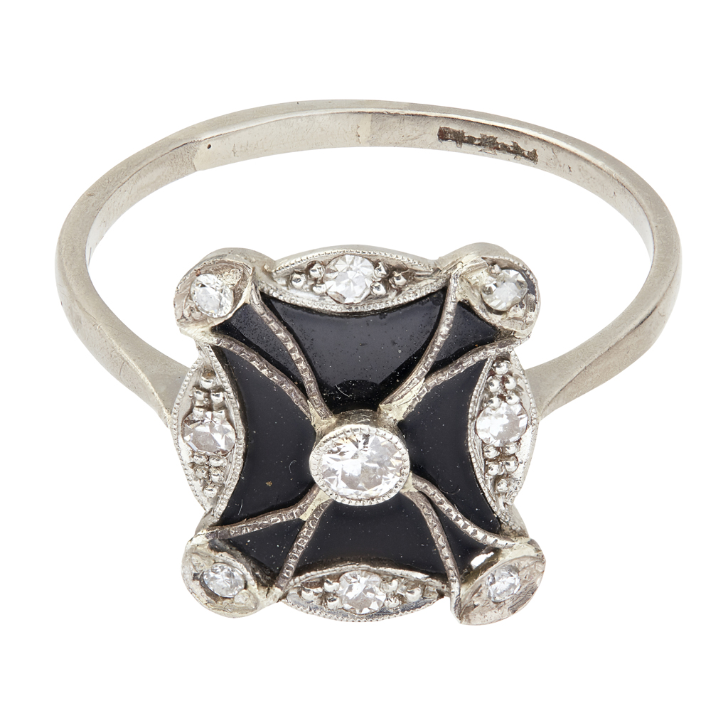 An Edwardian onyx and diamond set ring