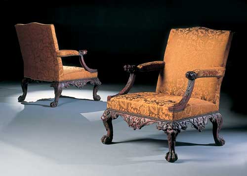 An important pair of mahogany library armchairs in the George II manner