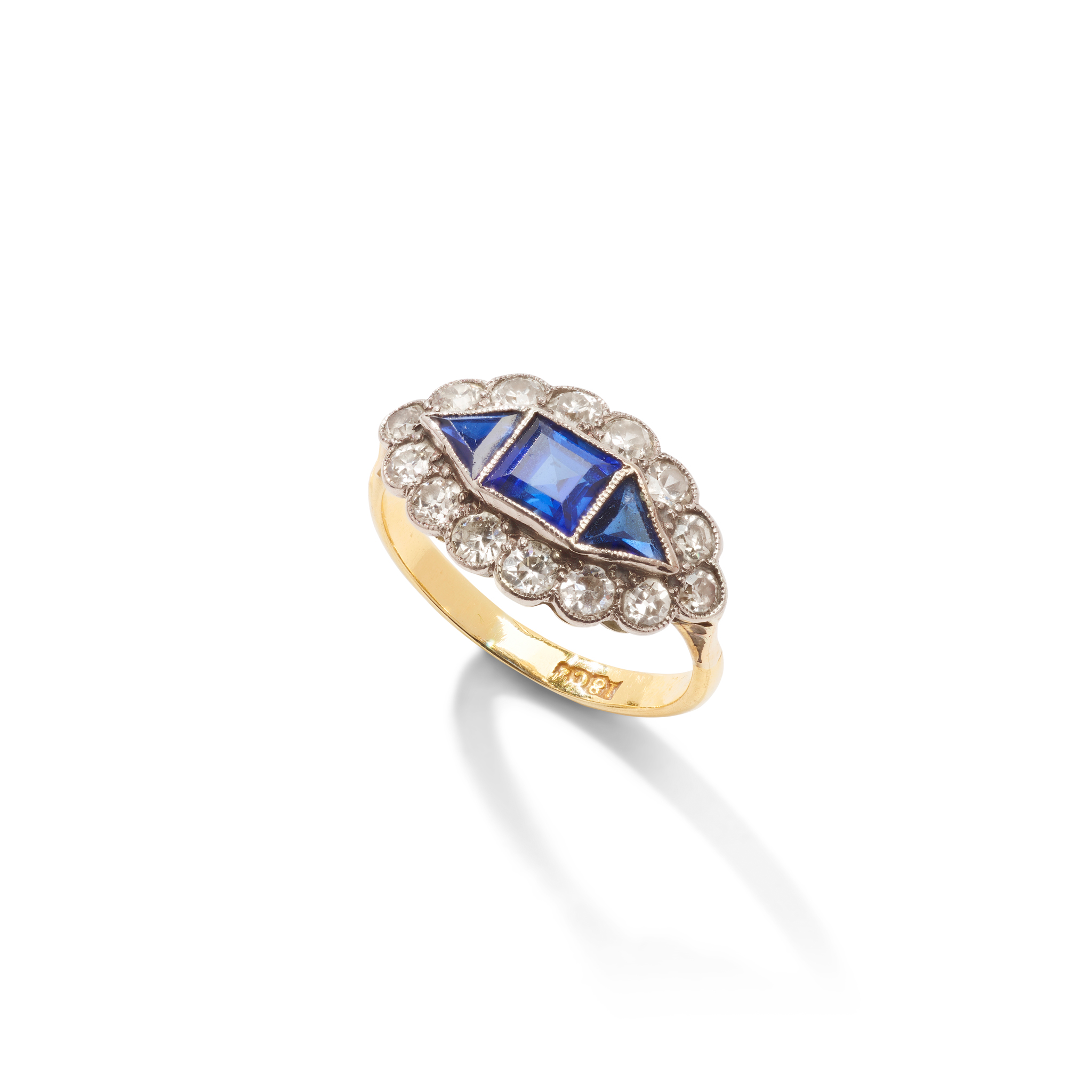 A synthetic sapphire and diamond cluster ring