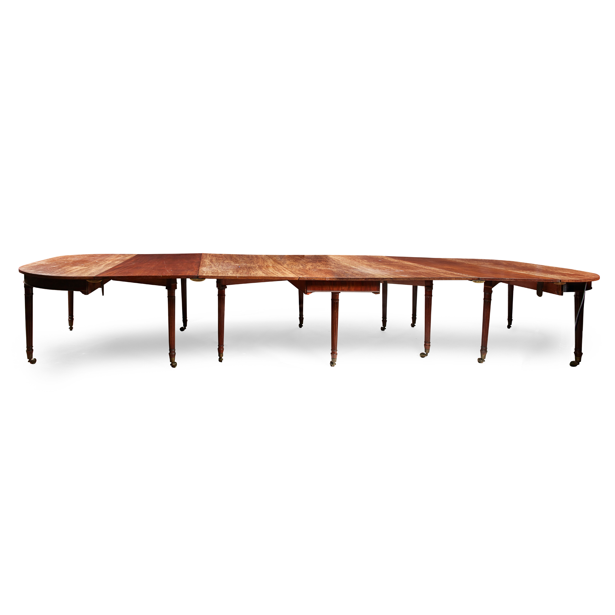 A LATE GEORGE III MAHOGANY DINING TABLE
