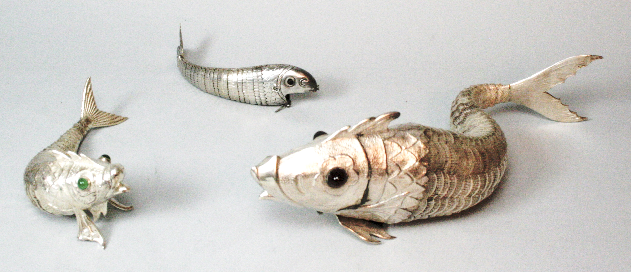A group of three continental models of fish