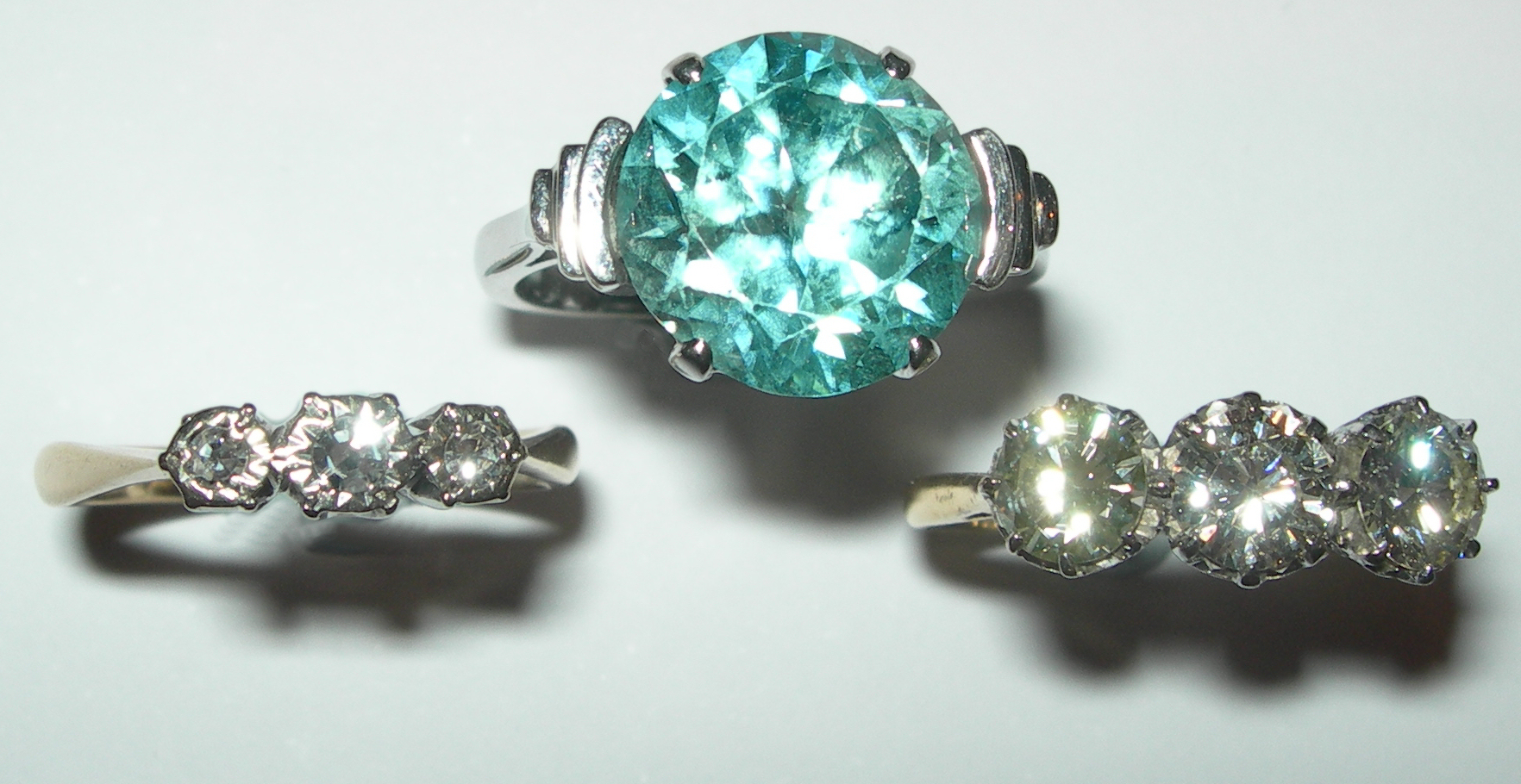 An 18ct gold and platinum mounted three-stone diamond ring,