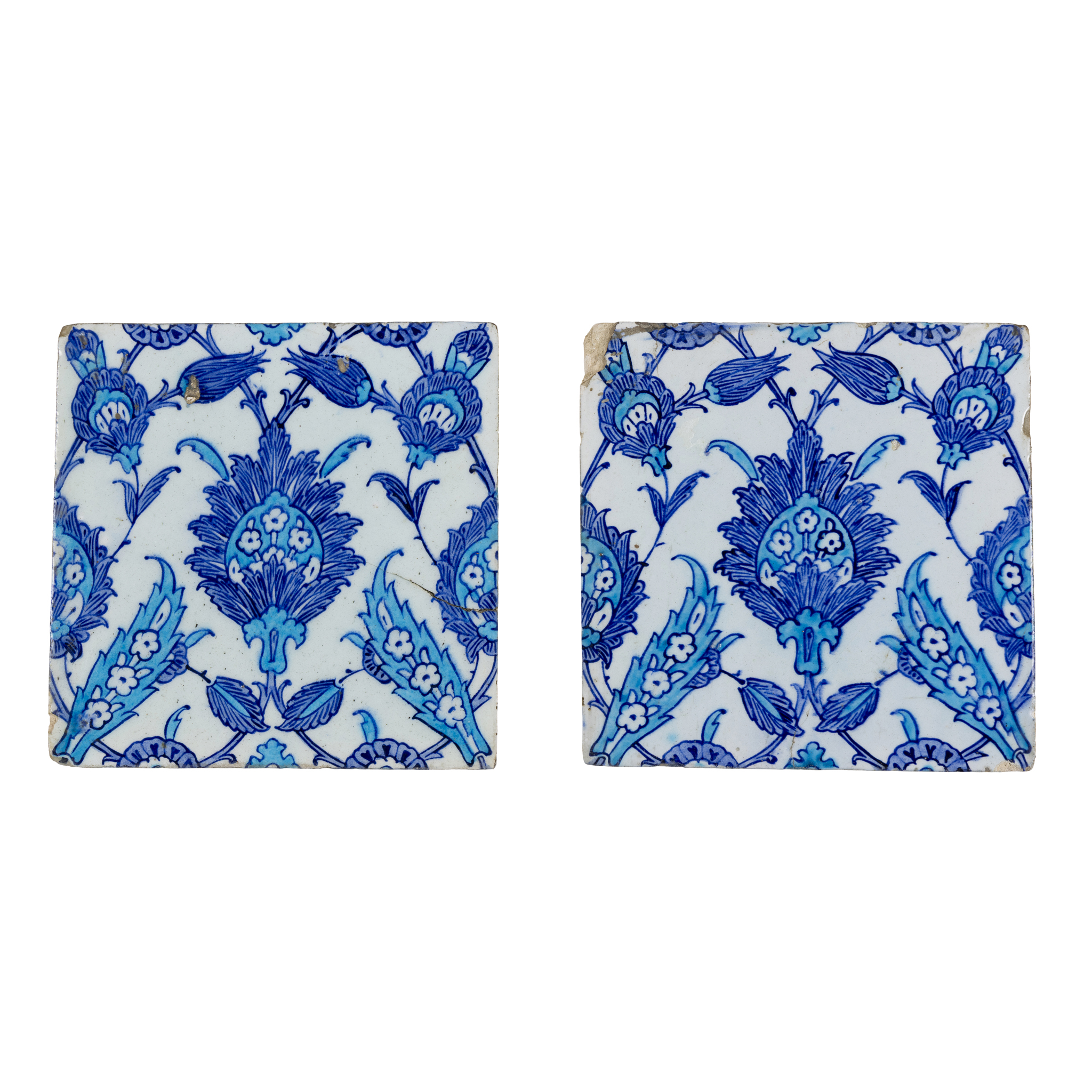A PAIR OF IZNIK BLUE AND WHITE POTTERY TILES