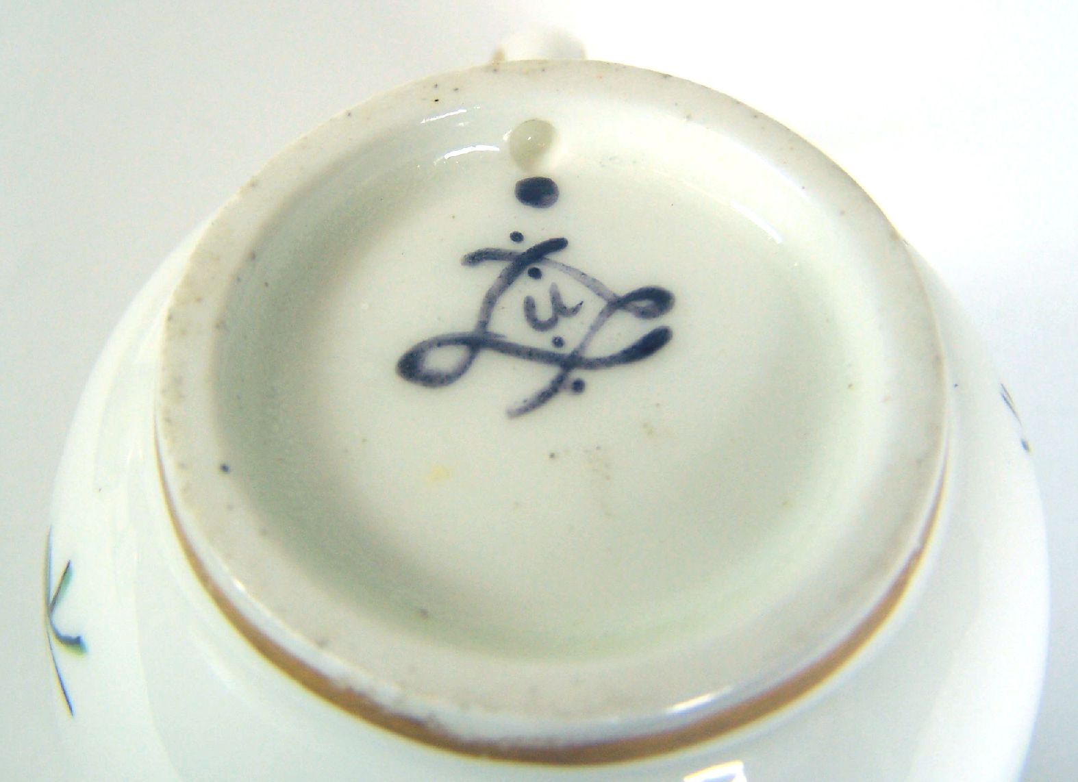 THREE SIMILAR SÈVRES TEA CUPS AND SAUCERS