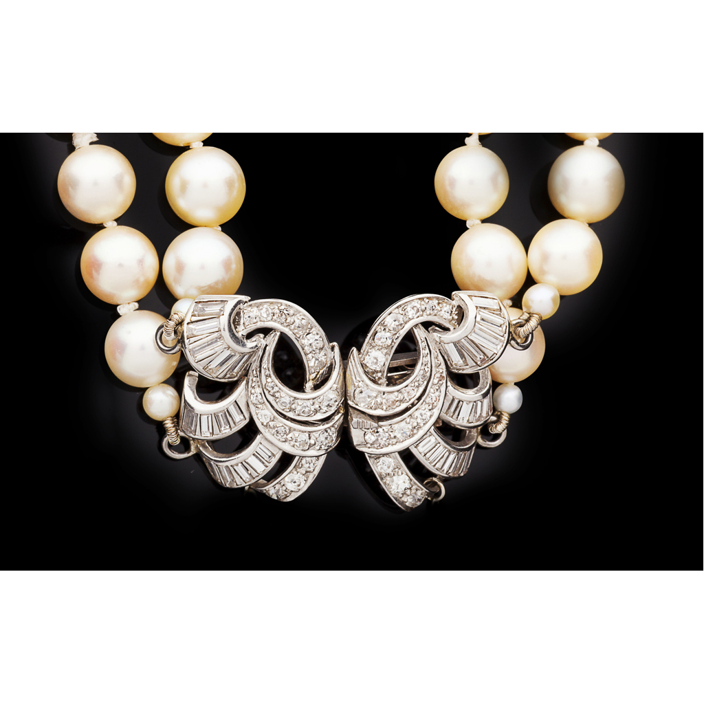A two-row cultured pearl necklace with diamond clasp