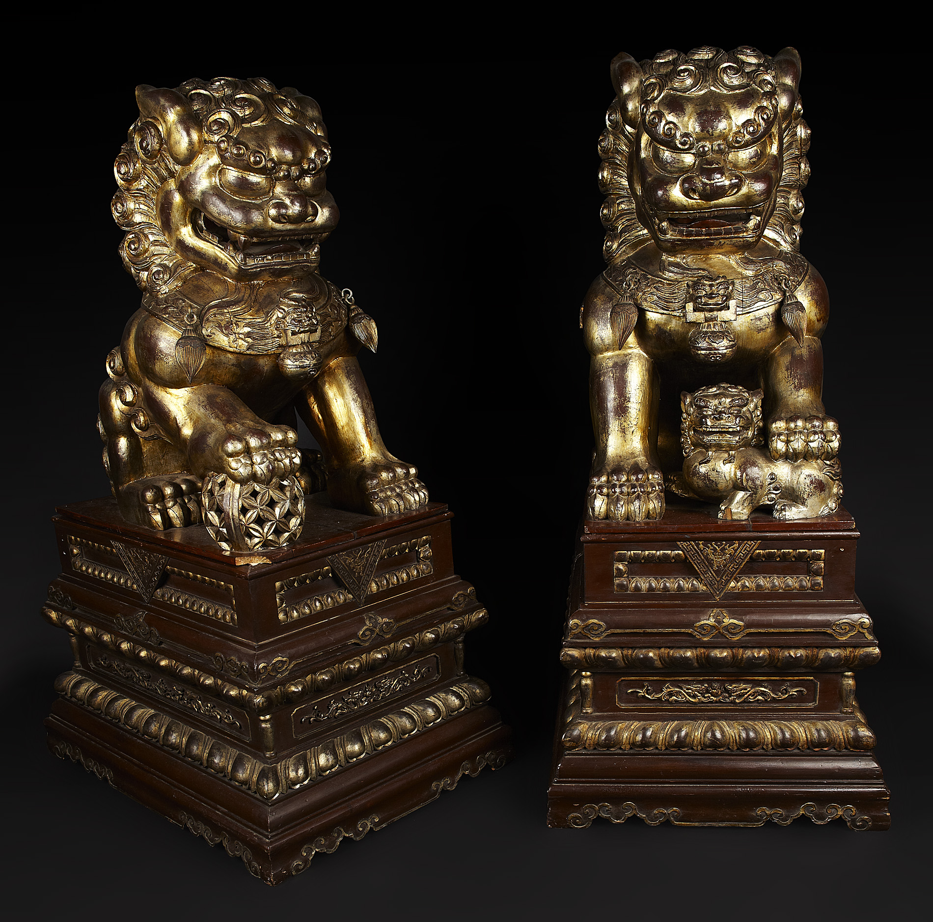 PAIR OF LARGE CHINESE CARVED, PAINTED AND PARCEL GILT TEMPLE LIONS