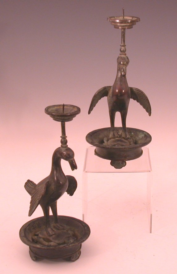 A pair of Chinese bronze pricket candlesticks,