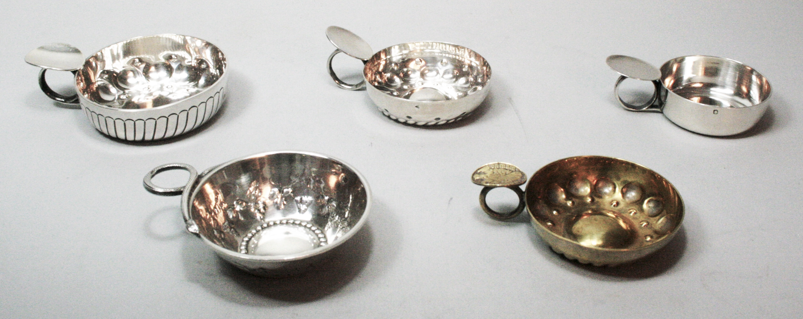 A group of five various wine tasters