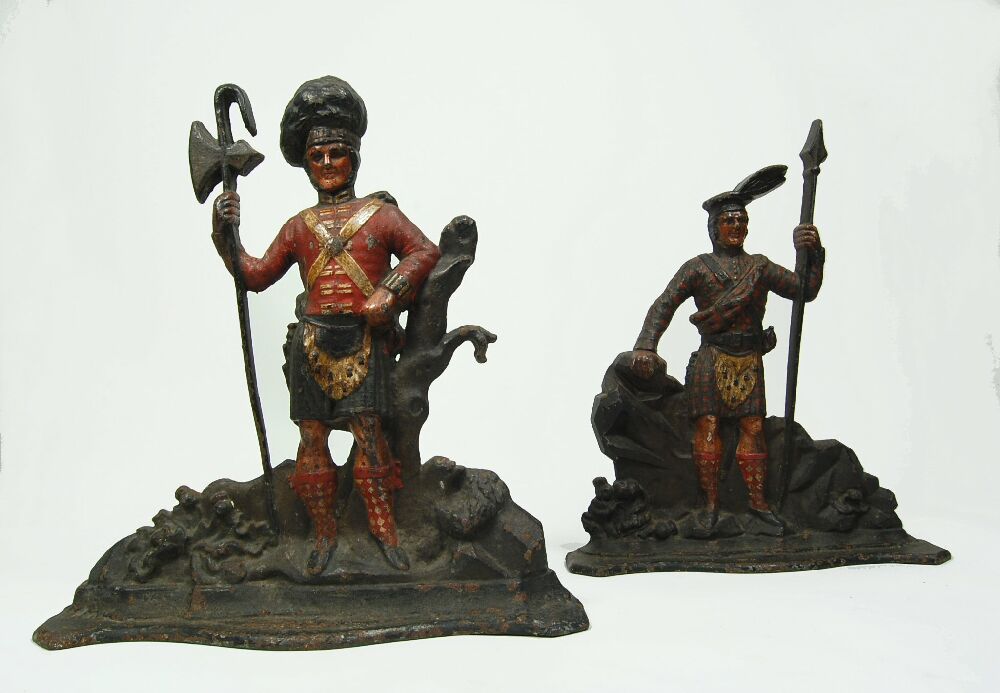 A matched pair of 19th century Scottish 'Highlander' cast iron door stops