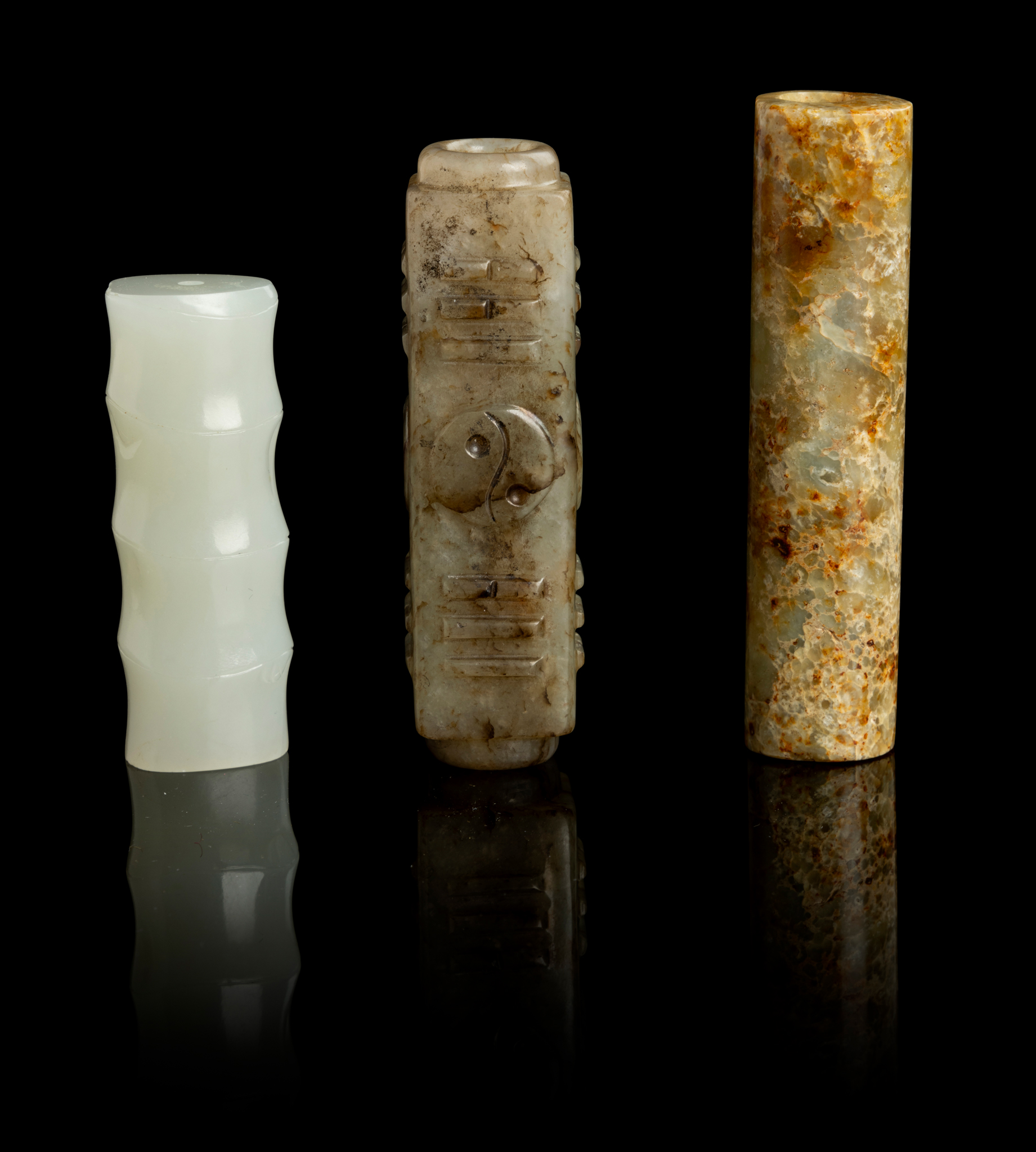 GROUP OF THREE JADE TUBULAR PENDANTS