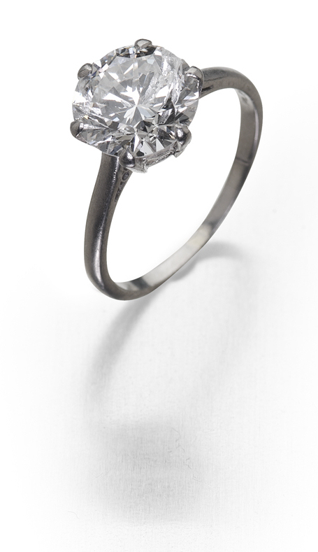 A platinum mounted diamond single-stone ring,