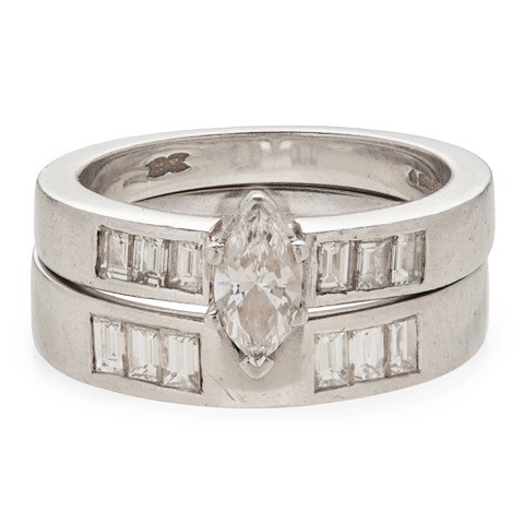 A marquise cut diamond ring and matching band