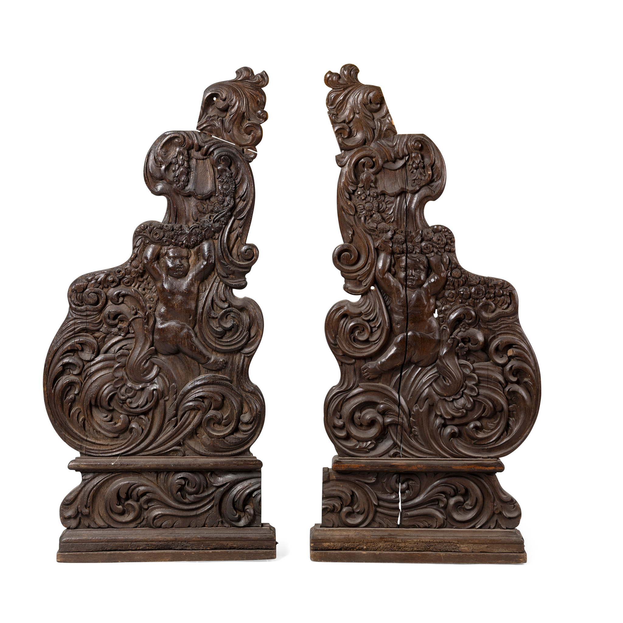 A PAIR OF CARVED OAK PEW ENDS