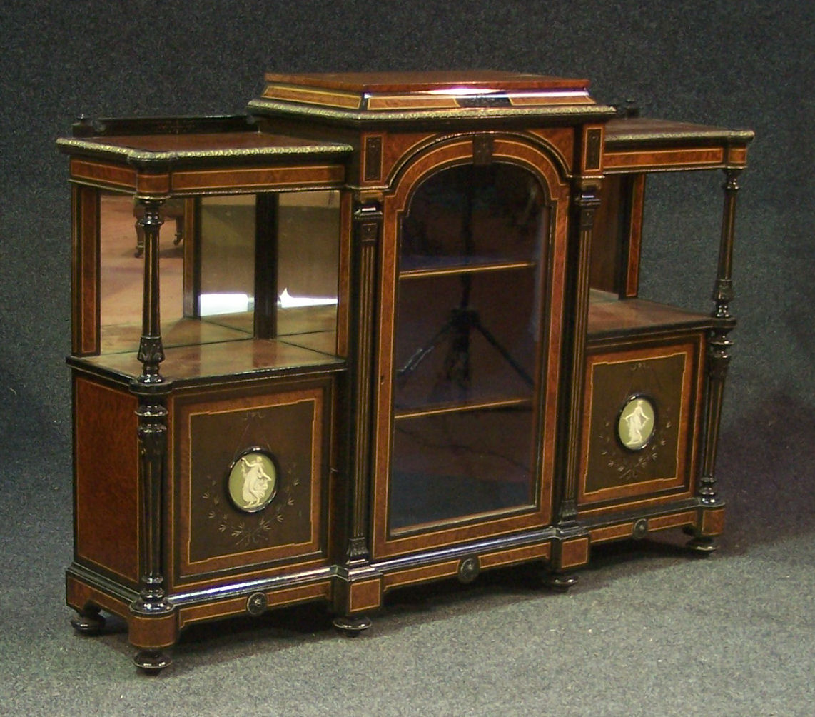 A late Victorian amboyna, ebonised, inlaid and gilt metal mounted display cabinet,
