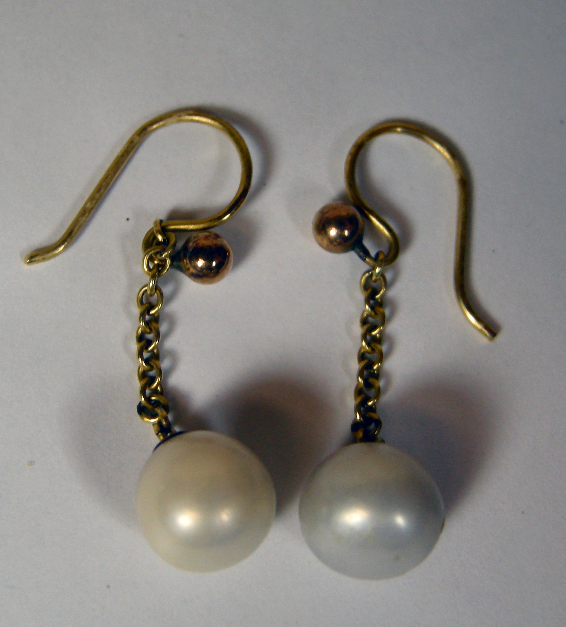 A pair of pearl earrings