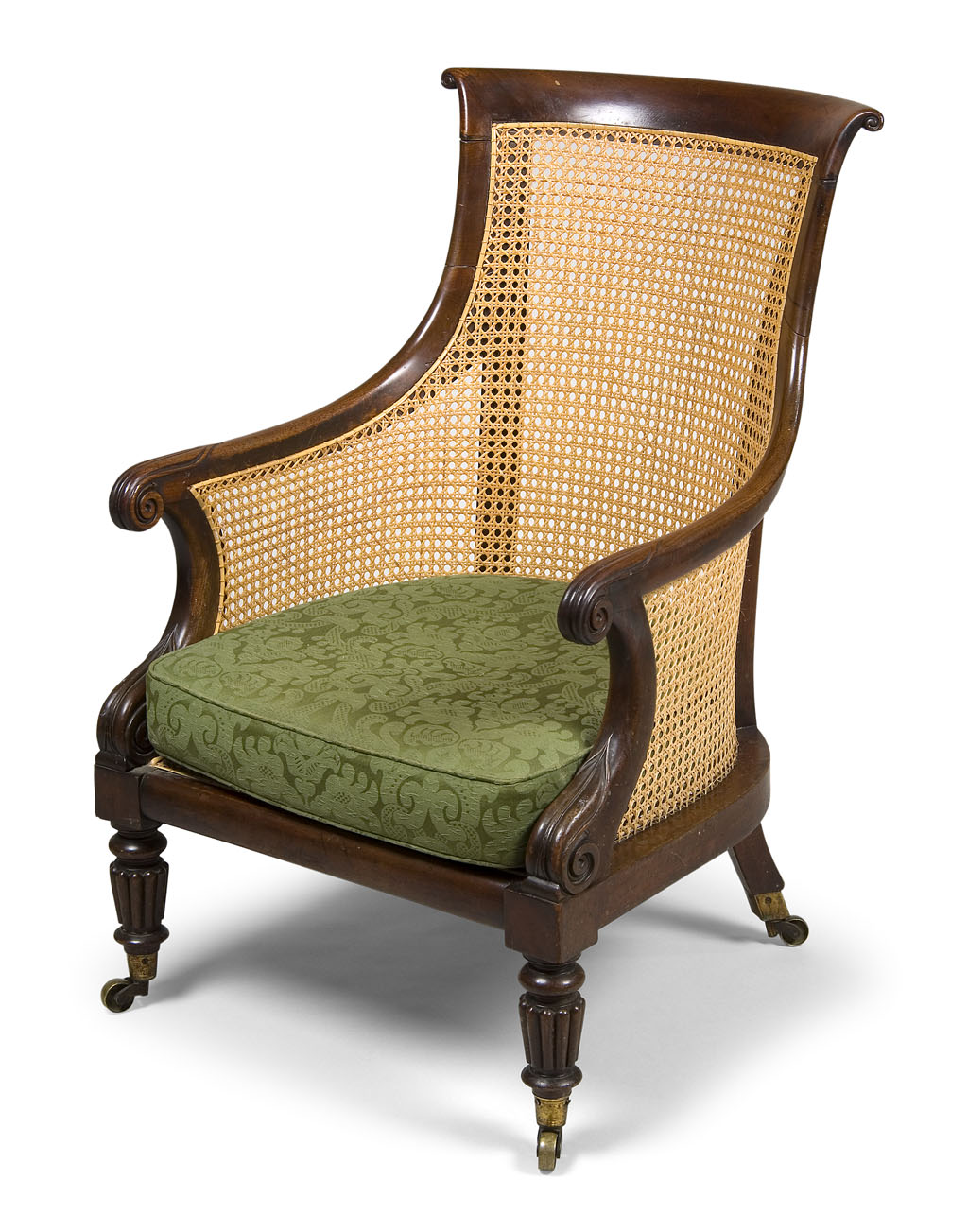A George IV mahogany and caned bergere armchair, circa 1825