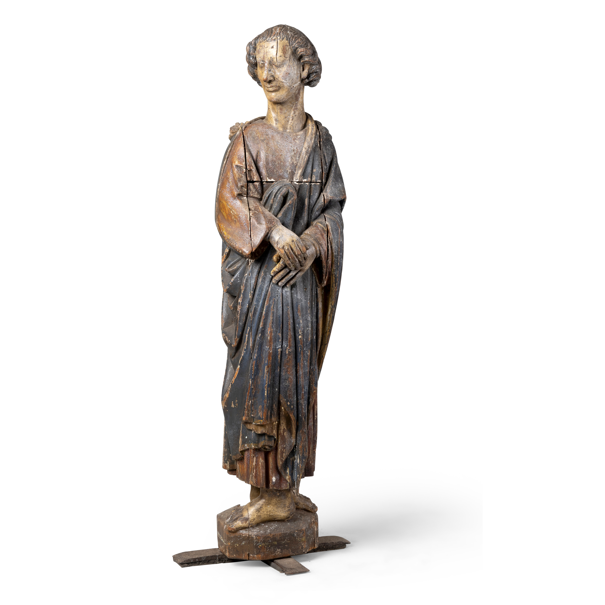 A CARVED POLYCHROME FIGURE OF AN APOSTLE OR SAINT